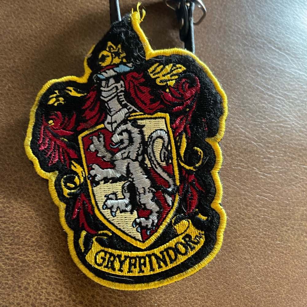 Harry Potter Gryffindor luggage tag yellow and black used